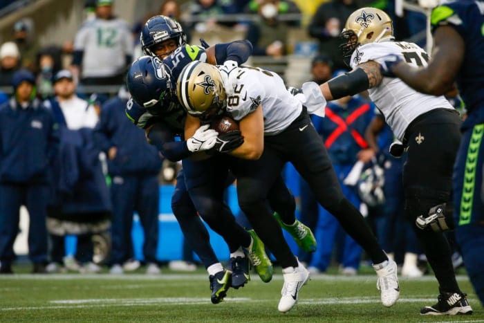 Seattle Seahawks linebacker Jordyn Brooks (56) tackles New Orleans Saints tight end Adam Trautman (82). Mandatory Credit: Joe Nicholson-USA TODAY Sports